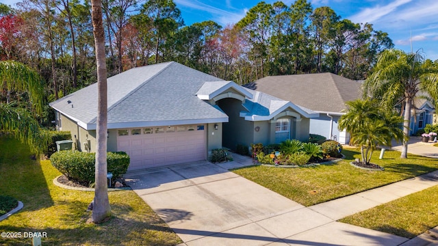 view of front of home with a garage and a front yard