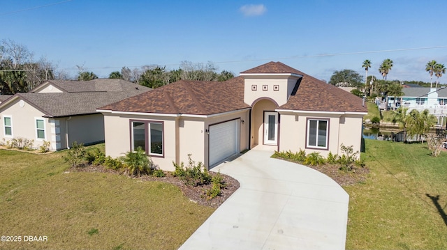 view of front of home with a garage and a front lawn