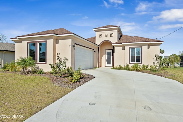 view of front facade with a garage and a front lawn