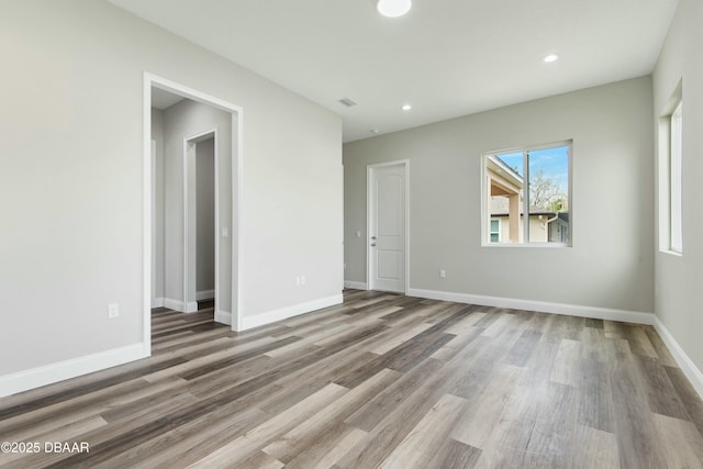 unfurnished room featuring wood-type flooring