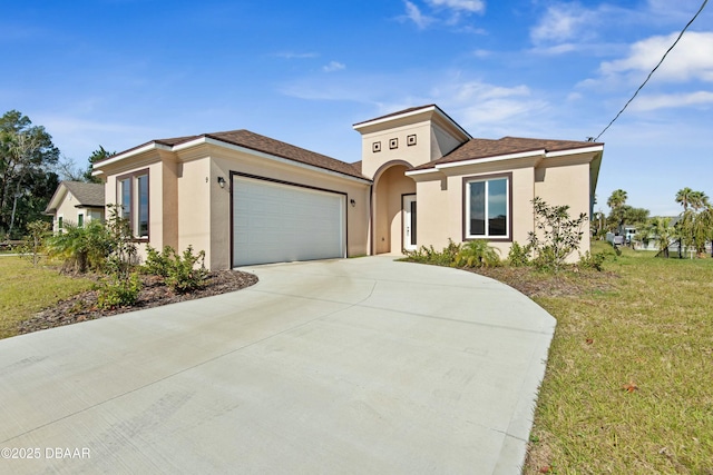 view of front facade with a garage and a front lawn