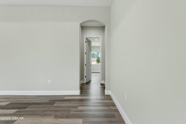 unfurnished room with dark hardwood / wood-style floors