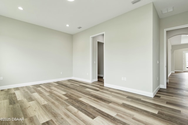 unfurnished room with light hardwood / wood-style flooring