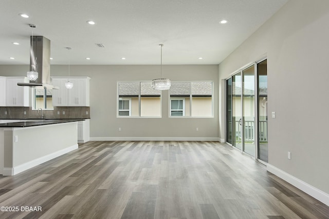 interior space with sink and light hardwood / wood-style flooring