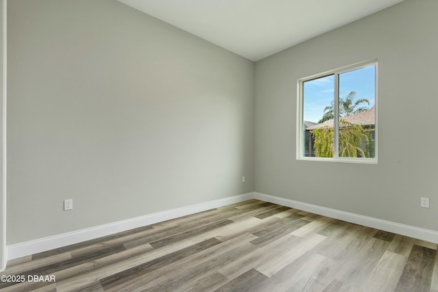 spare room featuring light hardwood / wood-style flooring