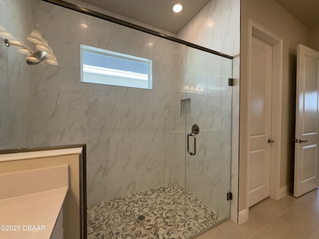 bathroom featuring tile patterned floors and a stall shower