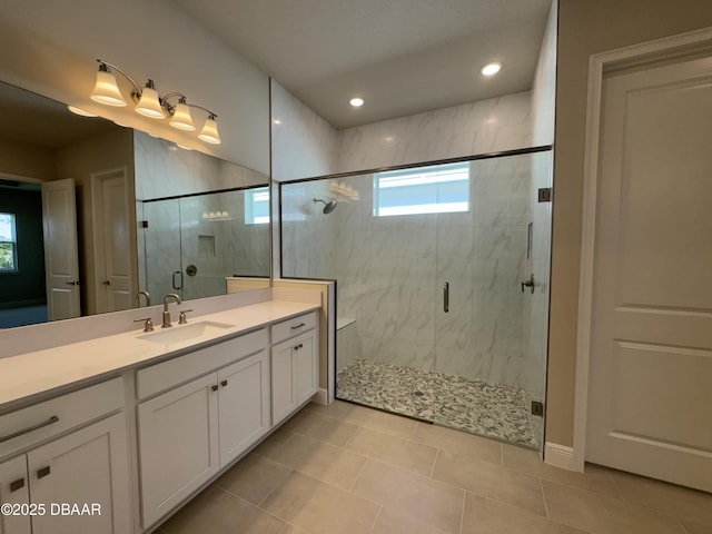 full bath with tile patterned flooring, recessed lighting, a shower stall, and vanity