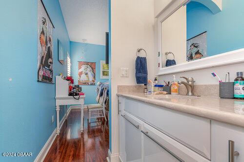 bathroom featuring hardwood / wood-style floors and vanity