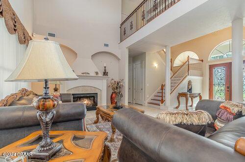 living room with a high ceiling