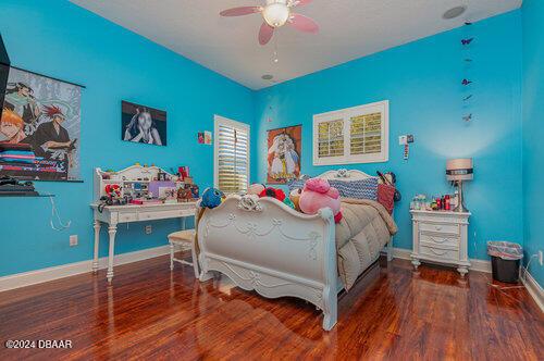 bedroom featuring ceiling fan and hardwood / wood-style floors