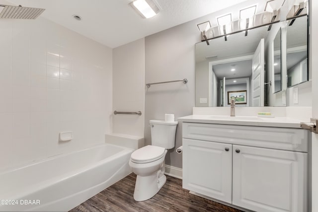 full bathroom featuring hardwood / wood-style floors, vanity, toilet, and tub / shower combination