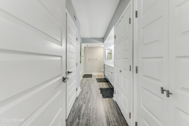 hallway featuring dark wood-type flooring