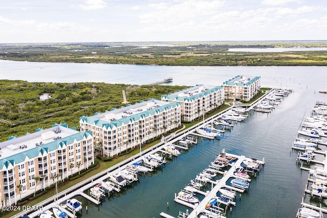 birds eye view of property with a water view