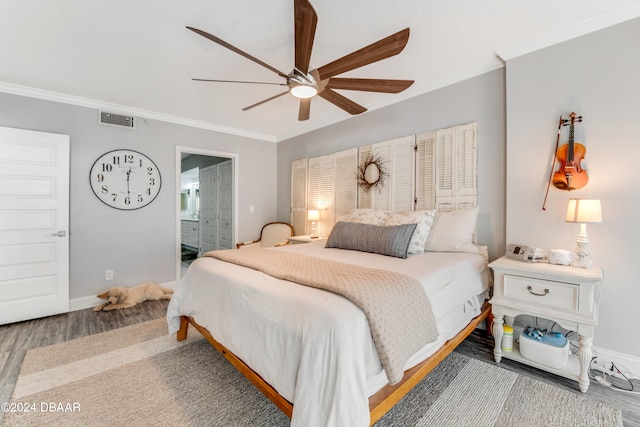 bedroom with ensuite bathroom, ceiling fan, crown molding, and hardwood / wood-style flooring