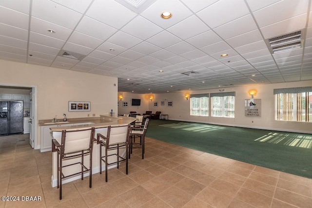 dining room with golf simulator and light carpet