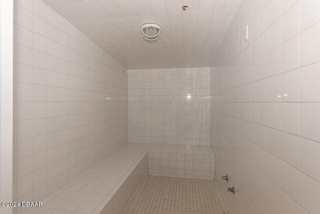 bathroom with tiled shower