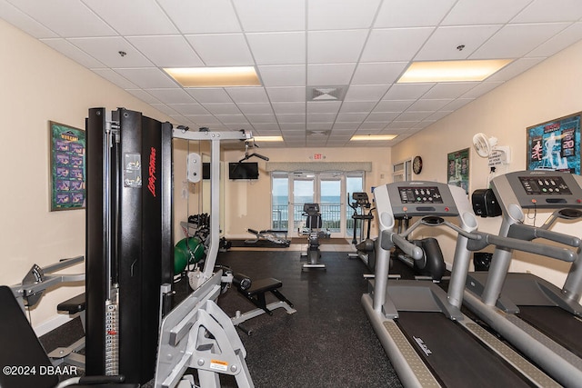 workout area featuring a paneled ceiling