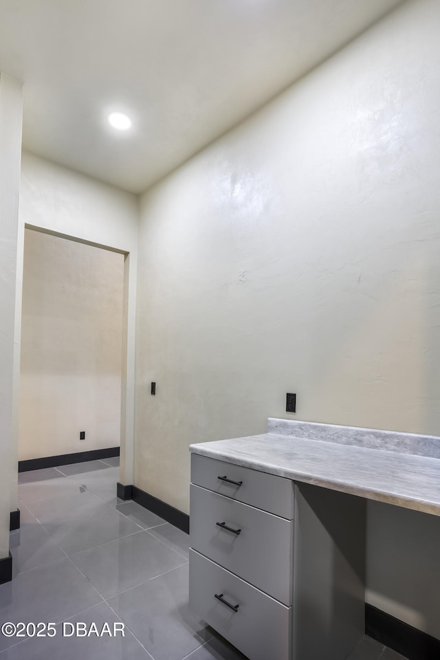 bathroom with tile patterned floors