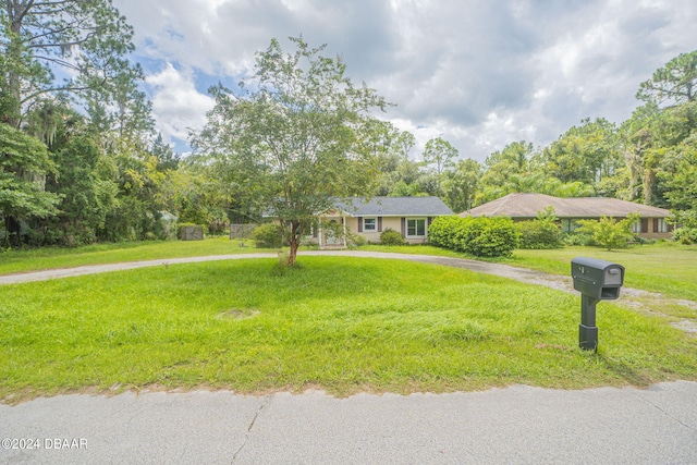 view of front of home with a front yard