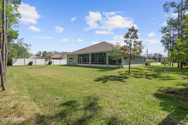 view of yard featuring a sunroom