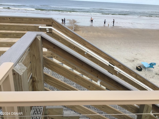 exterior space with a beach view and a water view