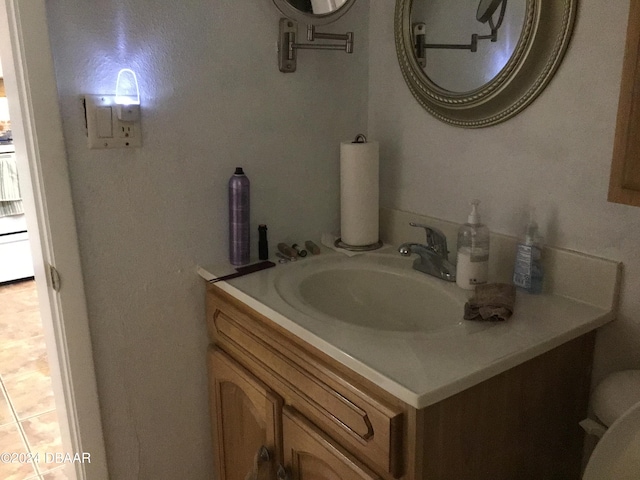 bathroom with vanity and tile patterned floors