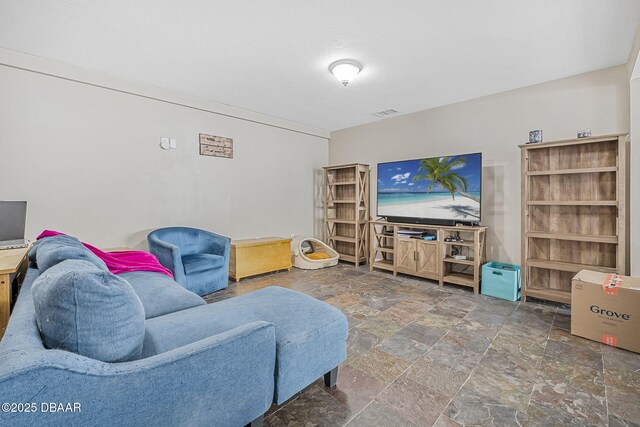living area with stone tile floors