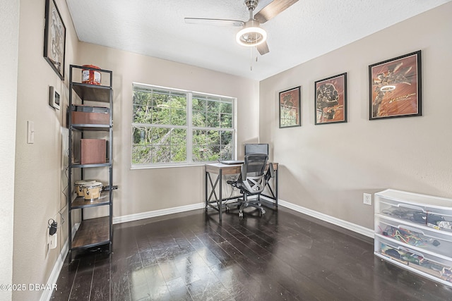 office area featuring a ceiling fan, baseboards, wood-type flooring, and a textured ceiling