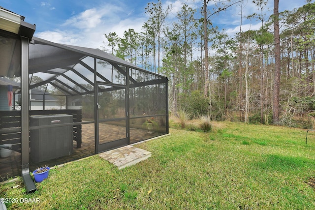 view of yard featuring central air condition unit and glass enclosure