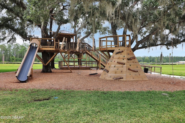 communal playground featuring a yard