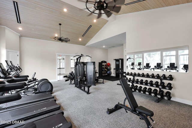 workout area featuring plenty of natural light, wood ceiling, baseboards, and high vaulted ceiling