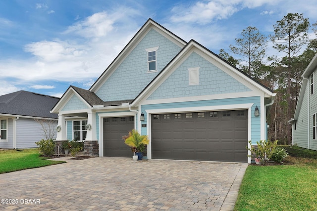 craftsman-style home with decorative driveway