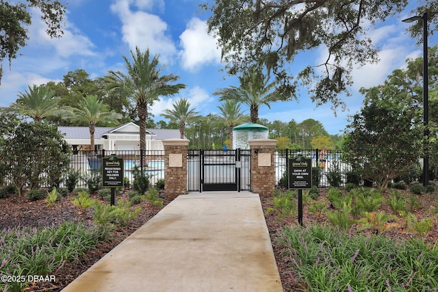 view of gate with fence