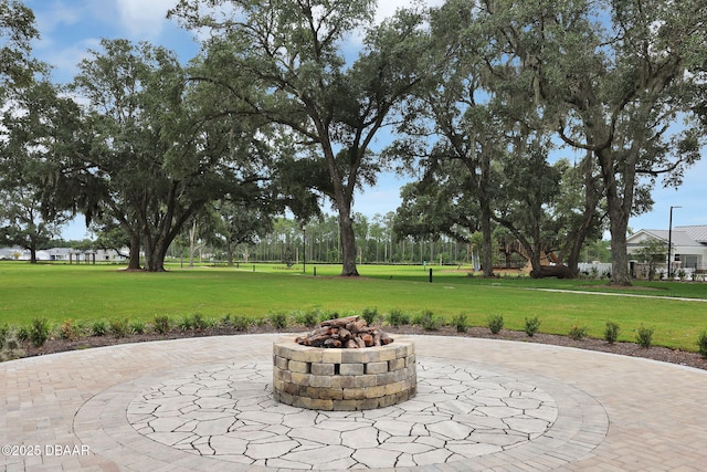 view of patio / terrace featuring a fire pit