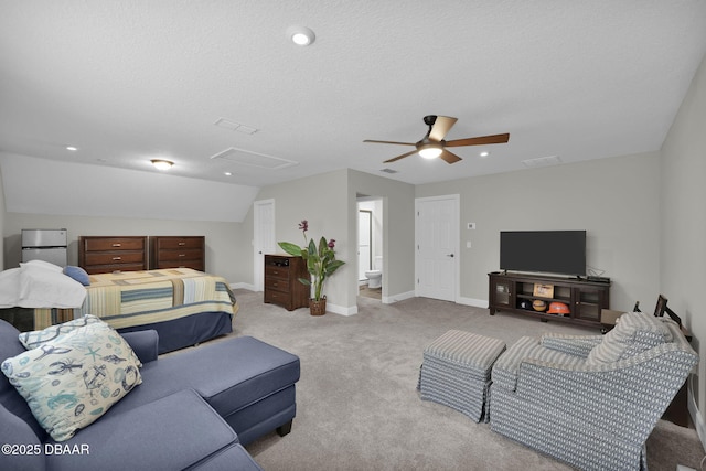 bedroom featuring visible vents, lofted ceiling, carpet floors, baseboards, and attic access