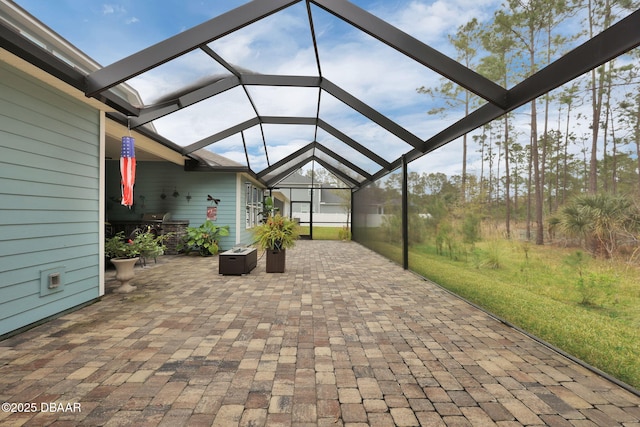 view of patio / terrace with a lanai