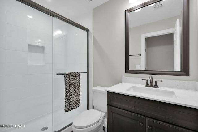 full bathroom with visible vents, toilet, a stall shower, and vanity