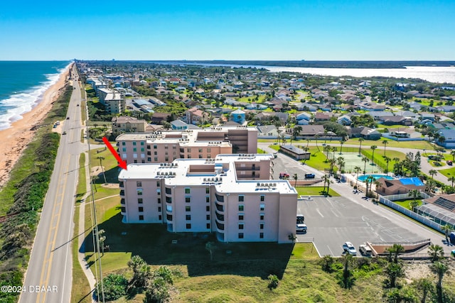 drone / aerial view with a view of the beach and a water view