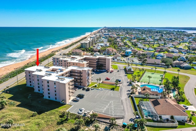 aerial view featuring a water view and a beach view