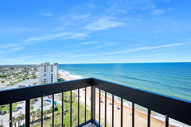 balcony with a view of the beach and a water view