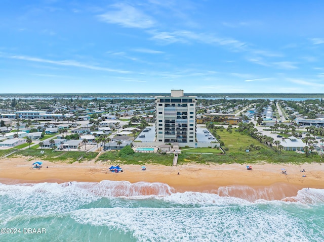 aerial view featuring a view of the beach and a water view