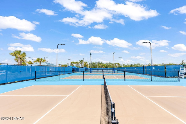 view of sport court with basketball hoop