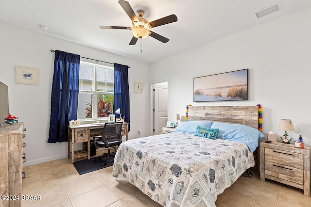 bedroom with ceiling fan and light tile patterned floors