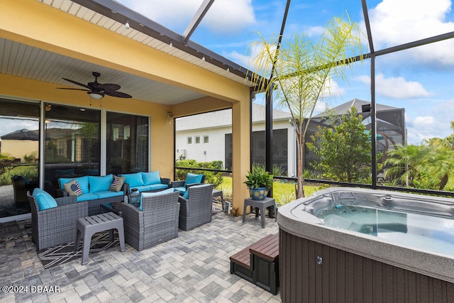 view of patio / terrace with an outdoor living space and a hot tub