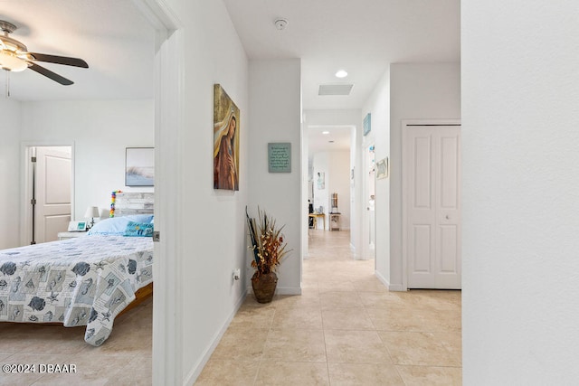 hallway with light tile patterned floors