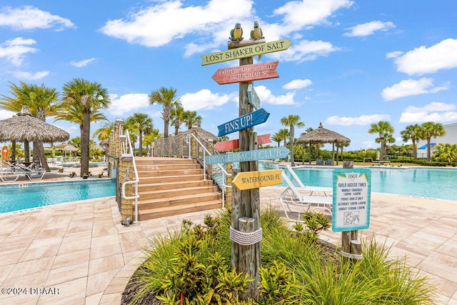 view of swimming pool featuring a gazebo and a patio