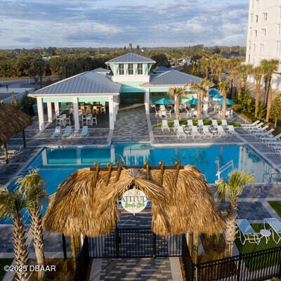 view of swimming pool with a gazebo and a patio