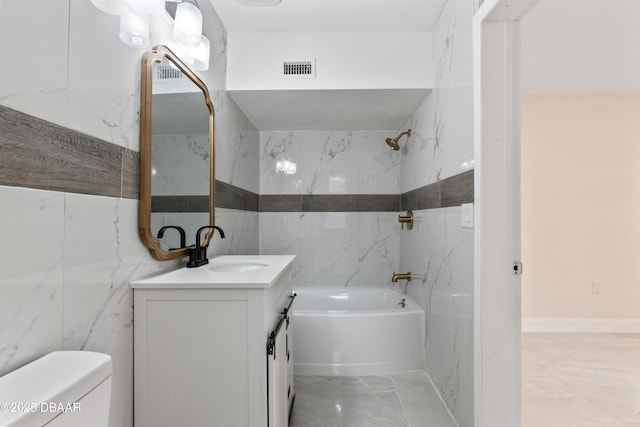 full bathroom with toilet, marble finish floor, shower / bath combination, and vanity