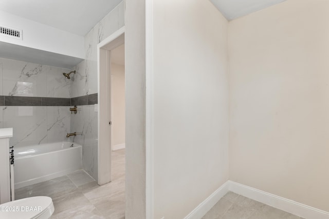 bathroom with toilet,  shower combination, visible vents, and baseboards