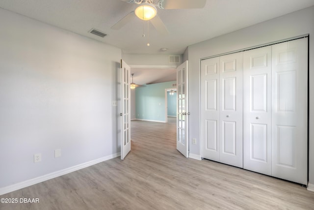 unfurnished bedroom with light wood finished floors, baseboards, a closet, and visible vents